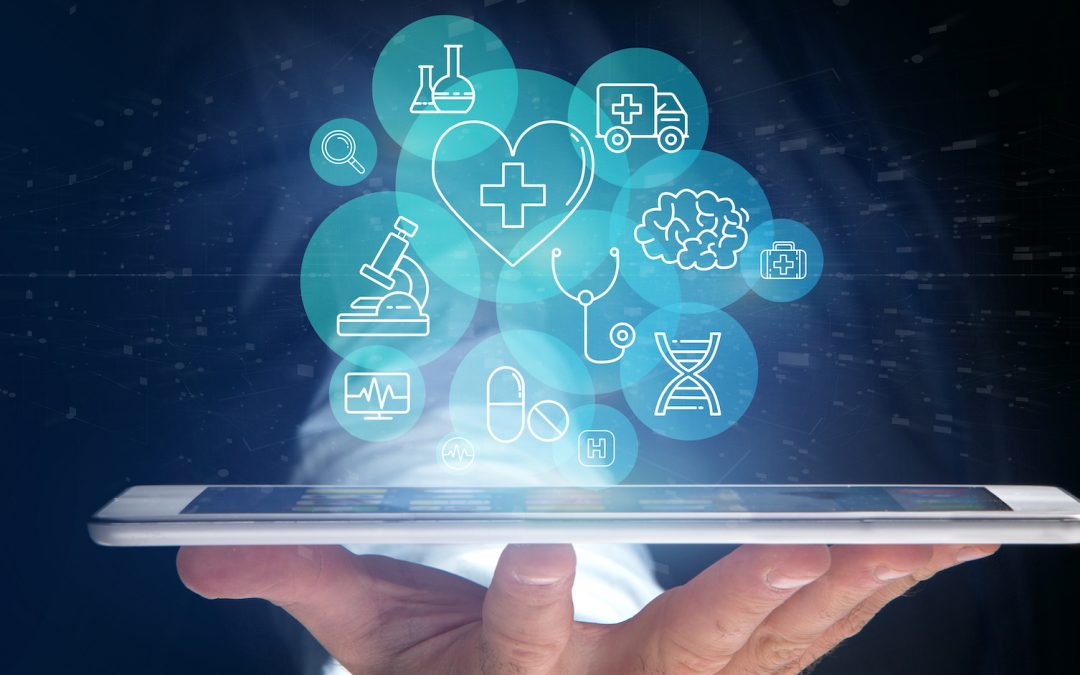 Hand holding a tablet with medical icons hovering above representing digital health.